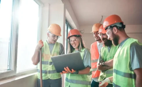 Construction worker taking OSHA 10 training online on laptop