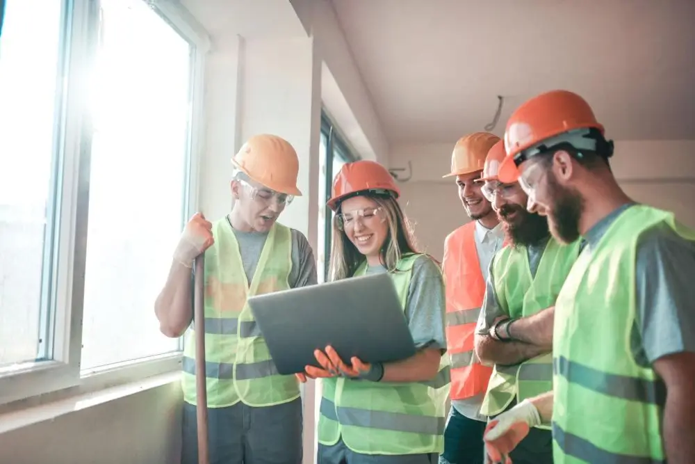 Construction worker taking OSHA 10 training online on laptop